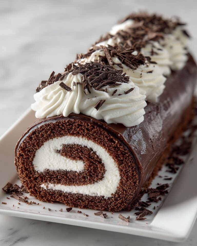 Classic Yule Log Cake with Chocolate Frosting and Sugared Cranberries Recipe